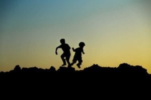 children playing during sunset