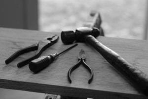 black and white tools. pliers, hammer, screwdriver